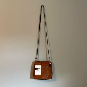 Primo Sacchi store bought. Cognac color (listed as tan) w/ dark brown trim. NWT